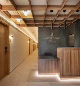 a hallway of a conference room with a reception desk at Feelathome Cortes in Madrid