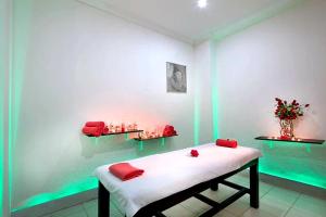 a room with a bed with red pillows on it at Çamyuva Luna Hotel in Kemer