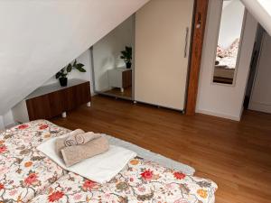 a bedroom with a bed with towels on it at Stuttgart Nest in Stuttgart