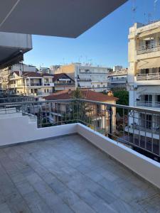 a balcony with a view of some buildings at Unique Centro Apartment in Kilkis