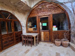 an entrance to a building with a wooden door at Uchisar Cave House in Uçhisar