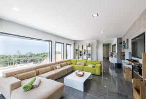 a living room with a couch and a table at Villa Monchique in Monchique