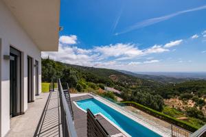 a view of a swimming pool from a house at Villa Monchique in Monchique