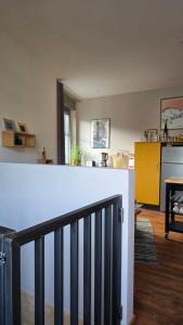 a kitchen and living room with a counter top at T1 duplex centre Argeles Gazost in Argelès-Gazost