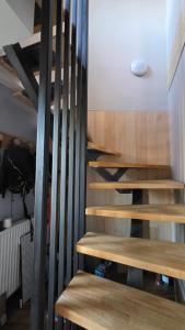 a set of wooden stairs in a room at T1 duplex centre Argeles Gazost in Argelès-Gazost