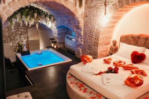 a room with a bed and a swimming pool at Moira Suite in Bitonto