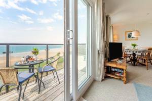 a living room with a view of the ocean at 2 Bed in Putsborough oc-flat31 in Croyde