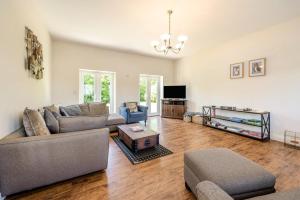 a living room with two couches and a tv at 4 Bed in Bideford oc-76452 in Parkham