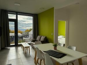 a living room with a table and a couch at Simple Aparts in El Calafate