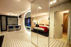 a hotel room with a bed and a bathroom at Apartament Studio - Târgu Neamț ,Premium Hotel Style in Târgu Neamț