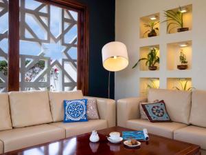 a living room with a couch and a table at Nungwi Dreams by Mantis in Nungwi