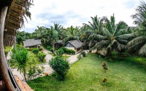an aerial view of a resort with palm trees at Antafondro Lodge in Sainte Marie