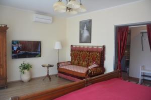 a living room with a couch in a room at Apartments Orange Lovran in Lovran