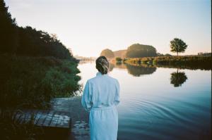 a woman standing in front of a body of water at Mooirivier in Dalfsen +50 photos