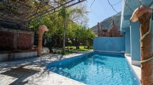 a swimming pool in the backyard of a house at Riad Rêve D'Ourika in Ourika