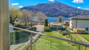 a balcony with a view of a lake and mountains at Casa Belfiore in Maccagno Superiore