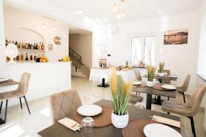 a dining room with a table and chairs at Villa Rossa in Agerola