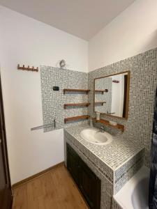 a bathroom with a sink and a mirror at maison du cinemà in Turin