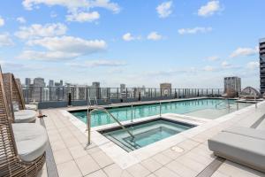 a swimming pool on the roof of a building at Prime Downtown Condo with City Views in Miami