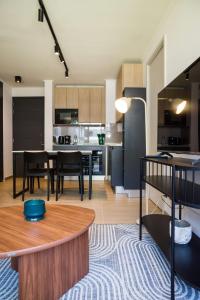 a kitchen and living room with a table and chairs at Chic Providencia Apt 2BR 2BA Sleeps 5 in Santiago