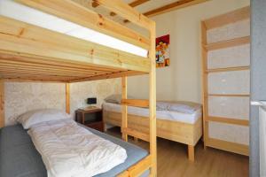 a bedroom with two bunk beds and a desk at Le Chêne d’Or in Marcheseuil +82 photos