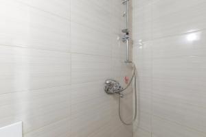 a shower with a hose in a bathroom at Stella's Olive Tree House in Adelianos Kampos +20 photos