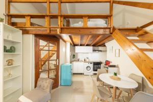a kitchen and dining room with a table and chairs at Urban Nest in Sevran +15 photos