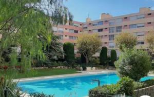 a large swimming pool in front of a building at L'échappée Méditerrannée in Vallauris