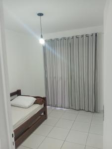 a bedroom with a bed and a window at SP , Interlagos,Expo Transamérica, 3 Hosp in São Paulo +6 photos