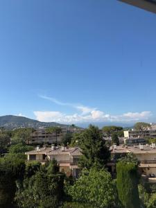 a view of a city with houses and trees at Azur Couple Studio in Mandelieu-La Napoule