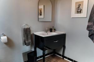 a bathroom with a sink and a mirror at The Red Door in Clarens +118 photos