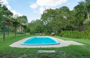 a swimming pool in the middle of a yard at Haras Ammi Shaddai in Cuitegi