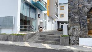 a building with stairs in front of a building at Alojamento Local Velas Balcony in Velas