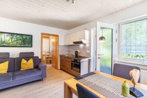 a living room with a couch and a table at Spinnertonihof in Bad Peterstal