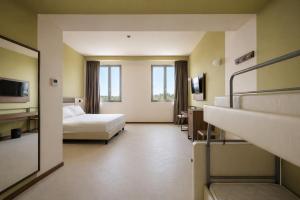 a hotel room with a bed and bunk beds at LVG Hotel Collection - Belfiore in Mantova +33 photos