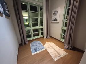 a room with a view of a room with a window at Dalem Kamulyan Kraton in Timuran +18 photos