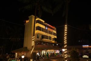 a building with a hotel sign on it at night at Silver Sea in Patna