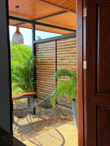 a sliding glass door with a patio with a plant at Apartamento 2, cerca de la playa, naturaleza y paz in Santa Cruz