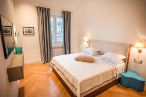 a bedroom with a large bed in a room at Apartments Captain's Villa in Budva +79 photos