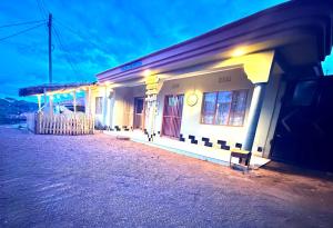 a building on the side of a street at night at Cajanus Inn & Safaris in Karatu