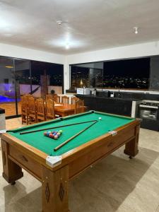 a pool table with cue balls on top of it at Recanto Feitosa Taubate in Taubaté