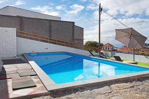 a swimming pool on top of a building at Casa Carreira in Ponta do Sol