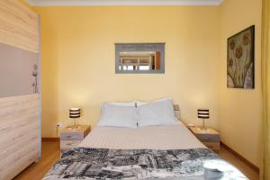 a bedroom with a large bed with two night stands at Casa Carreira in Ponta do Sol +22 photos