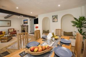a dining room with a table with a bowl of fruit at 2 Bed in Kingsteignton oc-w34194 in Kingsteignton