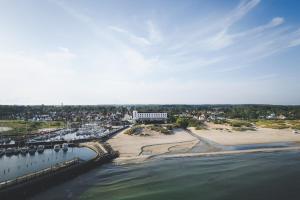 an aerial view of a beach and a harbor at CORI Hornbæk Hotel in Hornbæk