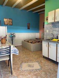a kitchen with a bed and a table in a room at paldisfrute in Colón +9 photos