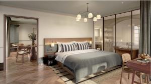 a bedroom with a large bed and a dining room at CORI Hornbæk Hotel in Hornbæk +8 photos