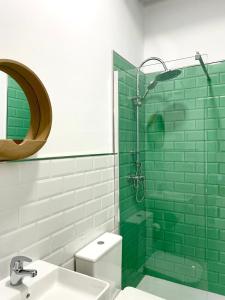 a bathroom with a sink and a glass shower at Galteo Alameda in Ronda +38 photos