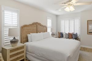 a white bedroom with a large bed and a ceiling fan at Sandestin Golf and Beach Resort in Destin +60 photos