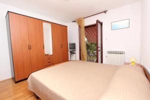 Postel nebo postele na pokoji v ubytování Rooms and Apartment Sanja